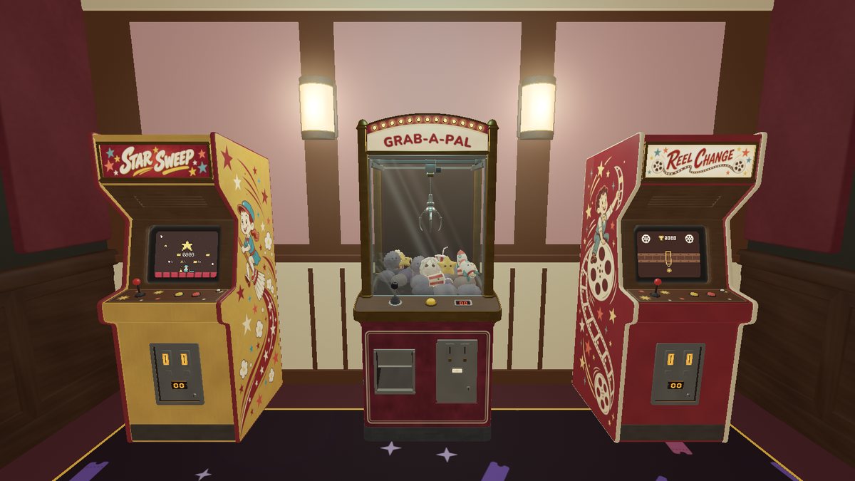 The arcade corner in the lobby, with two arcade cabinets and a claw machine.